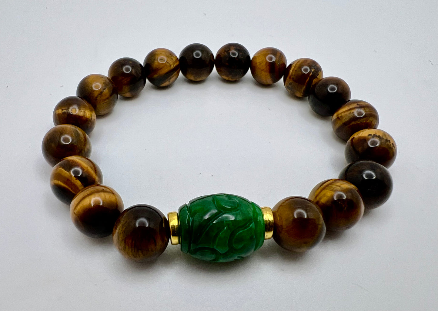 Tigereye crystal beads, and Myanmar Crystal Jade in the middle.