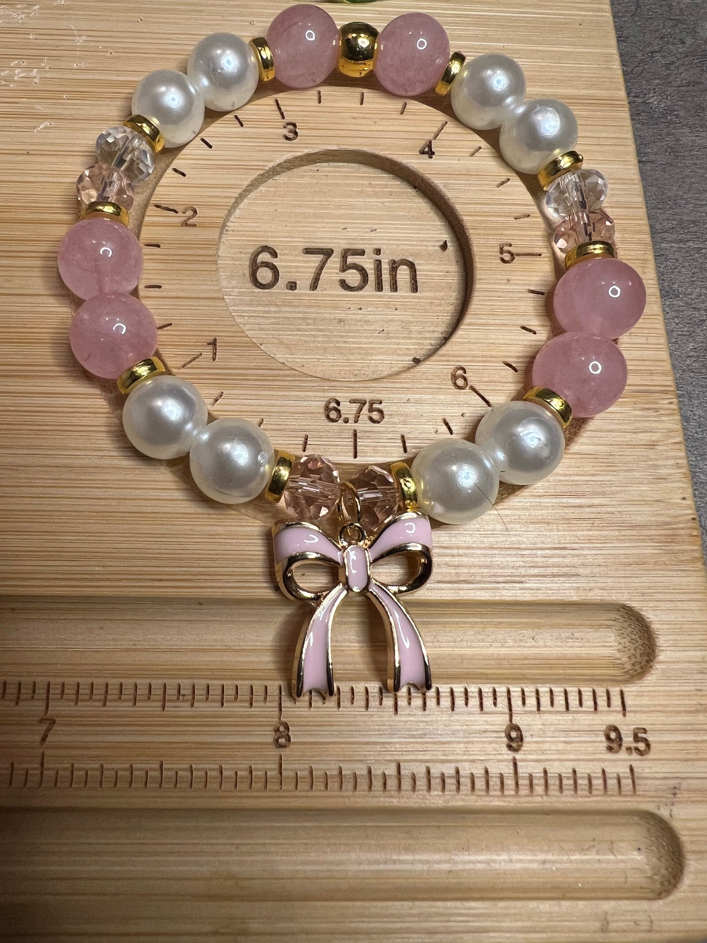 Gold tone bracelet with rose quartz and fashion pearl and pink bow