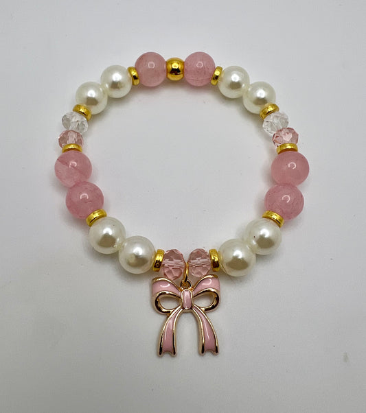 Gold tone bracelet with rose quartz and fashion pearl and pink bow